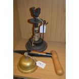 A brass table bell, a garden dibber and a garden string dispenser.