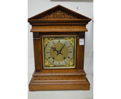 A good architectural oak cased mantel clock.
