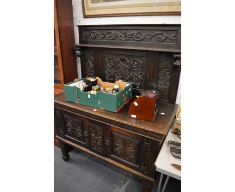 A Jacobean revival carved oak sideboard/buffet.