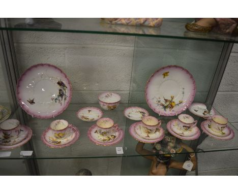 A Royal Worcester part coffee service decorated with birds.