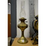 A brass oil lamp.