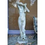 A reconstituted stone garden statue modelled as shy maiden.