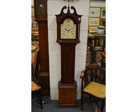 A reproduction mahogany grandmother clock.