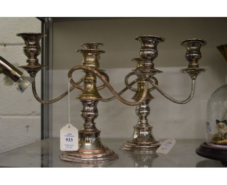 A pair of plated three light twin branch candelabra.