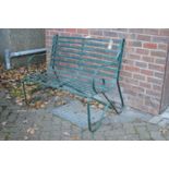 A Regency style wrought iron garden bench.