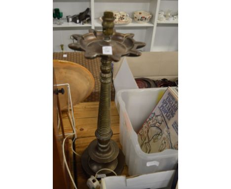An Eastern brass oil lamp converted to electricity.