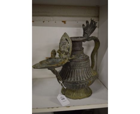An Indian metal ewer/oil lamp.