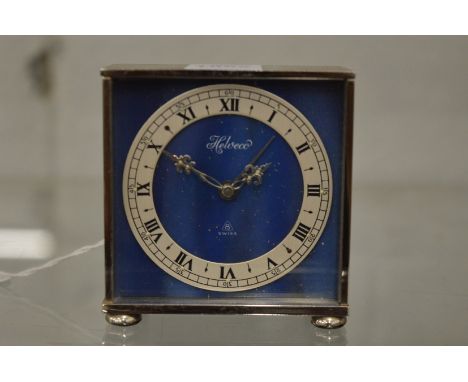 A small Helveco desk or bedside clock.