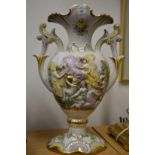 A decorative twin handled vase.