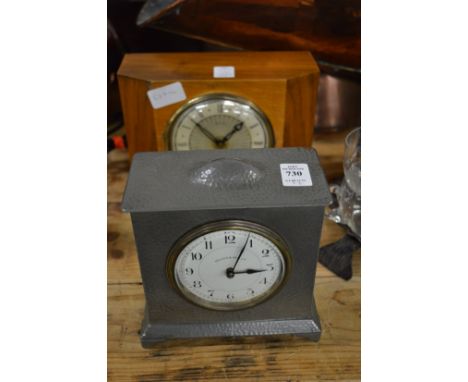 A Walker &amp; Hall pewter cased mantel clock and a walnut clock.