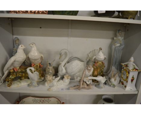 A collection of Lladro, Nao and other decorative china.