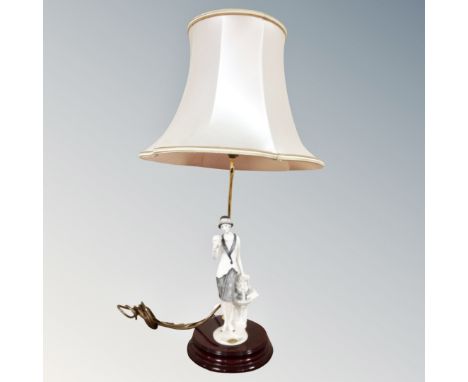 A Guiseppe Armani figural table lamp with shade in the form of an Art Deco lady with dove in hand 