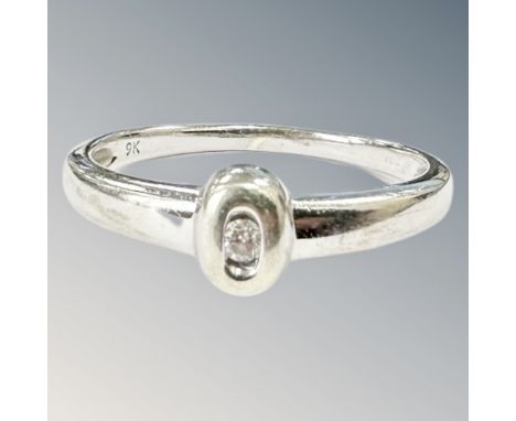 A 9ct white gold diamond solitaire ring. size R CONDITION REPORT: 2.7g