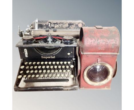 A vintage Imperial typewriter together with a signal railway lamp 