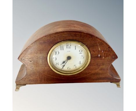 An Art Nouveau inlaid eight-day mantel clock.