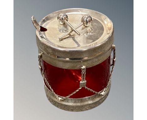 An interesting silver plated preserve pot modelled as a marching drum with batons to the lid, height 9 cm. 