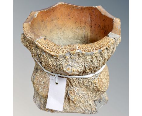 A tree trunk garden planter 