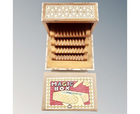 A 20th century wooden musical concertina cigarette box with mother of pearl inlay together with magic box in original box 