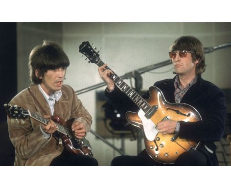 Vintage 35mm Bob Whitaker negative of Beatles John Lennon and George Harrison. playing their guitars during the Abbey Road se