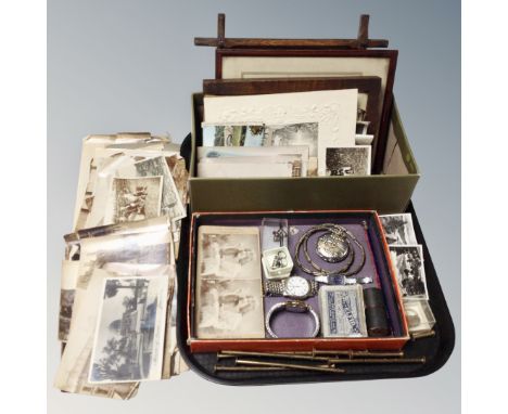 A tray of antique and later monochrome pictures and postcards, stereoscope cards, costume jewellery, silver coin ring, wristw