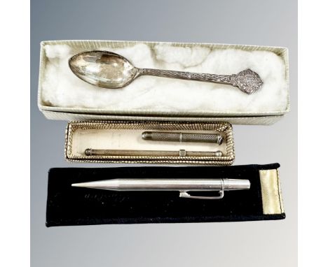 A silver 'Yard o' Lette' propelling pencil, a swizzle stick, a toothpick and a Lindisfarne silver teaspoon. (4)