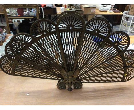 Brass fan fire screen with gargoyle decoration, and a set of brass fire toolsCondition report: Fire guard is in good order an