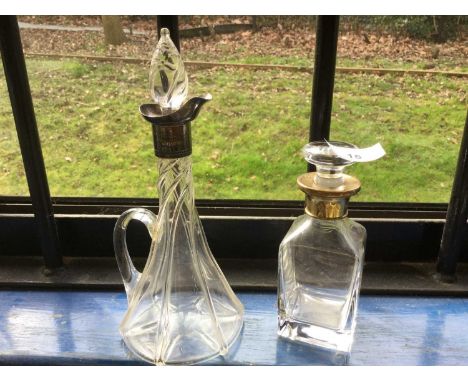 Silver mounted tapered glass spirit decanter, together with a silver gilt mounted glass scent bottle (2)Condition report: No 