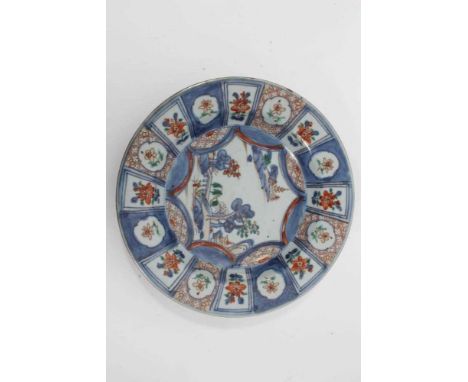 18th century Chinese Imari dish, painted with a landscape scenes bordered by panels of flowers, 23cm diameterCondition report