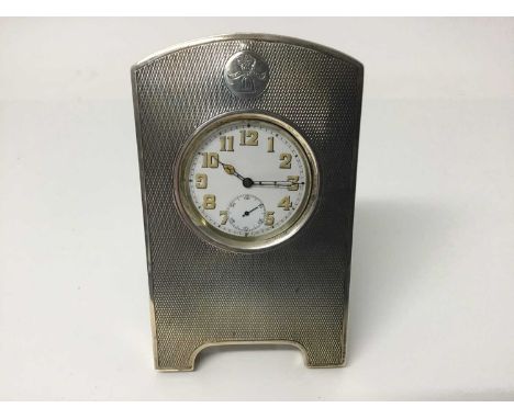 1920s silver pocket watch holder with engine turned decoration and engraved crest, with leather covered easel back (London 19