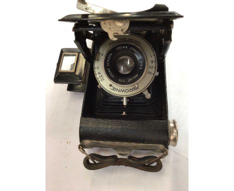 Eastman Kodak Co. box camera, another camera, group of mixed pictures and a stone pick with wooden handle