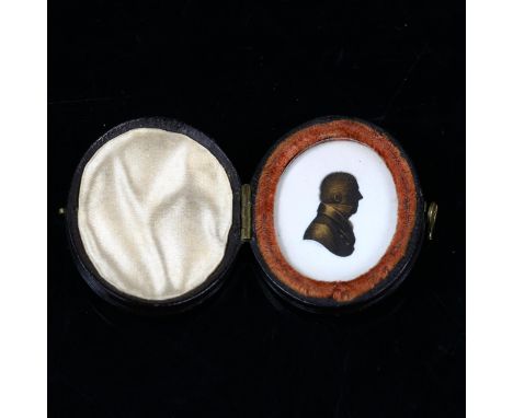 A miniature gilded silhouette portrait of a gentleman, by Miers & Field, in original leather case, case length 4cm 