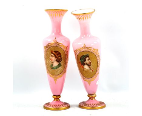 A pair of 19th century Bohemian pink glass vases, with hand painted and gilded portrait panels, height 31cm 
