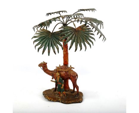 A cold painted spelter lamp in the form of camel and Arab under a palm tree, early 20th century, height 39cm 