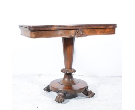 Victorian rosewood card table, rectangular fold-over top with rounded corners, baize lined, carved frieze, octagonal tapering