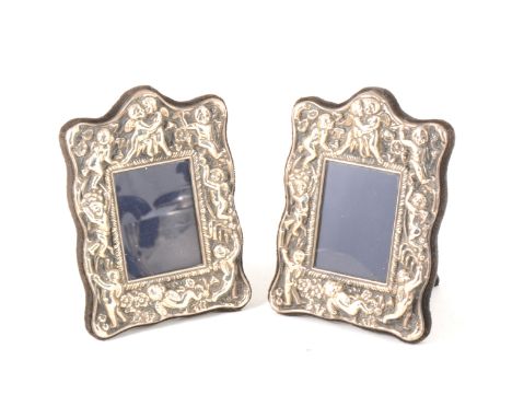 Two modern silver repousse chased photograph frames decorated with cherubs, Sheffield 1988, 12cm x 9cm. (Qty: 2)