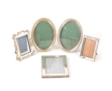 A pair of oval silver photograph frames, Charles S Green &amp; Co, Birmingham 1911, egg beaded outlines, 16cm x 11.5cm, a rec