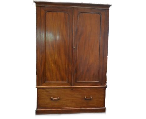 A Victorian mahogany double wardrobe, the fitted interior with robe to left and shelf above two open drawer and three closed 