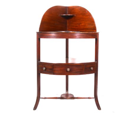 A mahogany corner washstand, raised gallery back, removable circular cover, the under tier with single drawer and two dummy d