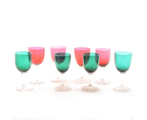 A collection of glassware including green and ruby coloured stemware, whisky glasses, tumblers, silver-plated mounted bottles