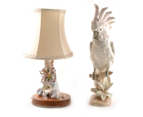 A Royal Dux model of a Cockatoo, No.402, 41cm; and a table lamp, incorporating a continental porcelain group. (Qty: 2)