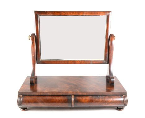 William IV mahogany toilet mirror, the rectangular plate raised in scrolled supports, on base with two trinket drawers, on bu