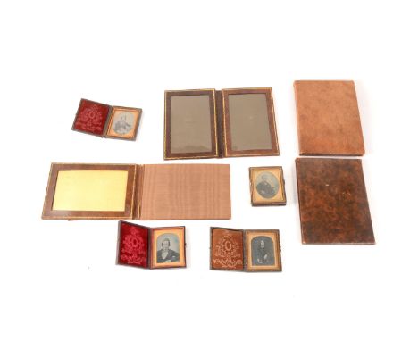 Four ambrotype photographs, each cased, and four folding leather photograph sleeves. (Qty: 8)