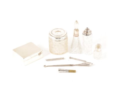 A collection of silver dressing table items, a glass perfume bottle with silver rim by Robert Pringle &amp; Sons, London 1913