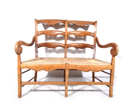 A teak twin-back two seat chair/ bench, with ladder backs, scrolled arms, large rush seat, width 128cm, depth 60cm, height 10