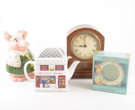 Wade Piggy Bank, other novelty egg cups, other ceramics, vintage picnic case, and a mantle clock with inlay.