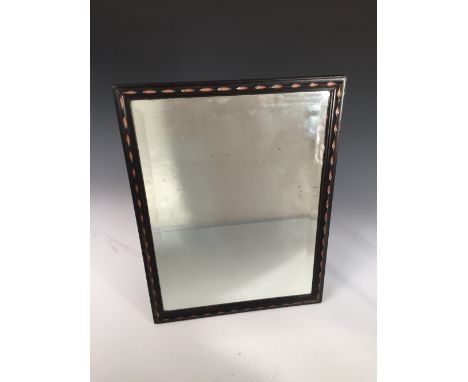 A Cotswold School ebony easel back mirror, the rectangular plate with chip carved frame and boxwood inlay 44 x 33cm (17 x 13i