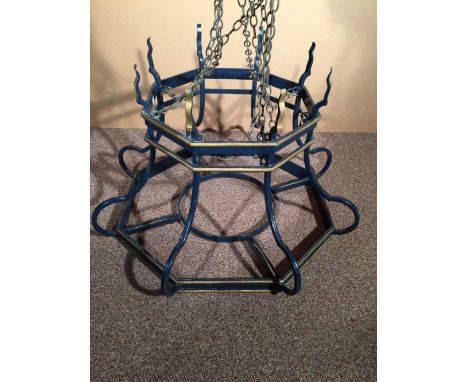 A large wrought iron chandelier, painted in blue with gilt detailing 49 x 79cm (19 x 31in)  