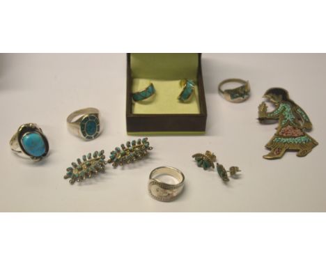 A collection of Native American jewellery including turquoise and enamel-set brooch featuring young female, two rings set tur