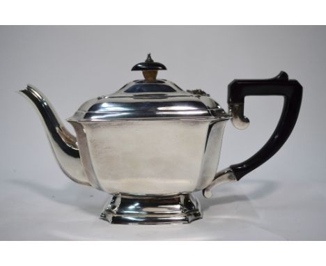 A heavy quality silver teapot of oblong form with canted corners, on flared foot rim, composite finial and handle, Elkington 