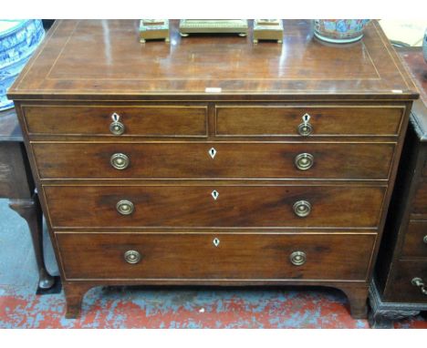 A George III satinwood line inlaid mahogany chest of two short over three long graduated drawers, with ivory diamond escutche